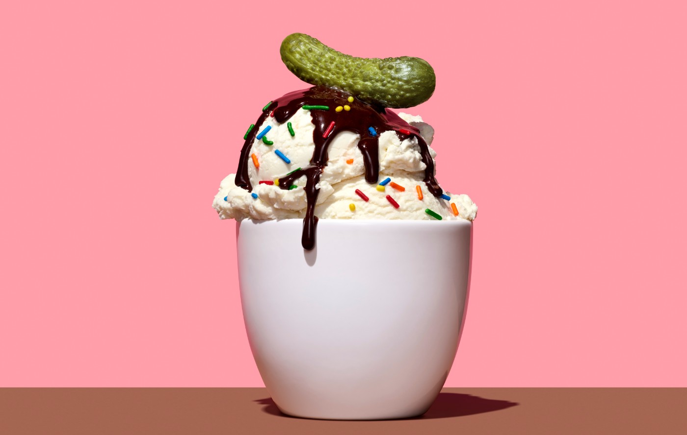 https://tickertapecdn.tdameritrade.com/assets/images/pages/md/Ice cream scoop in cup with sprinkles and chocolate with a pickle on top